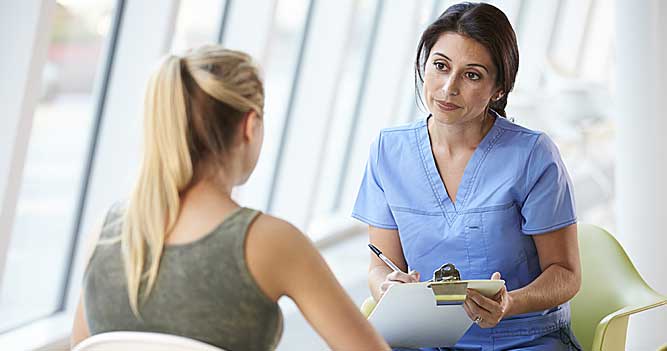 Nurse talking to a student at Toi Ohomai
