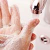 Closeup of postgraduate student washing their hands