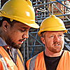 Tradesmen in hard hats on a construction 