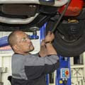 Student repairing a car in the garage at Toi Ohomai