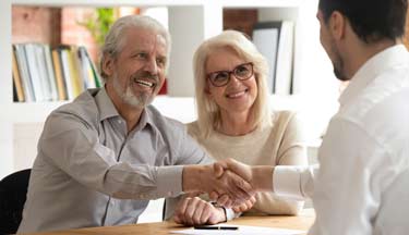 Real Estate salesperson with clients