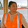 Maritime student on the controls of a boat