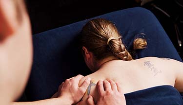Close up of client getting a massage on their back