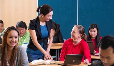 Student asking tutor a question during class