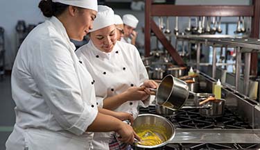 Culinary arts students cooking Culinary Arts thumbnail image