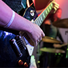 Closeup of hands on a guitar