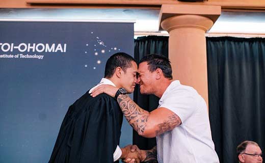 Graduate and tutor hongi
