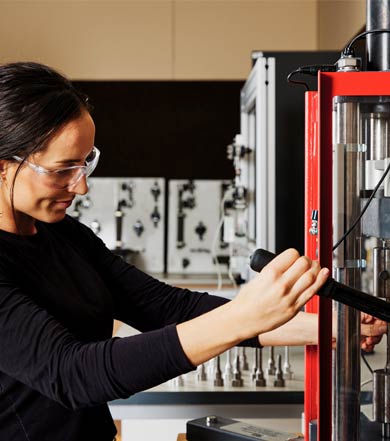 Engineering student using a lathe