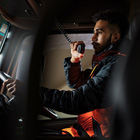 Student using the radio in a truck Class 2 Driver Licence course image