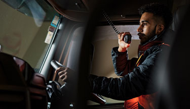 Student using the radio in a truck Class 2 Driver Licence course thumbnail image