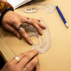 Student drawing an outline of a pattern Fashion Pathways image