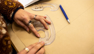 Student drawing an outline of a pattern Fashion Pathways thumbnail image