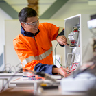 Electrical student working on a circuit Electrical student working on a circuit