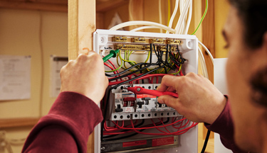 Electrical student working on a circuit Electrical student working on a circuit