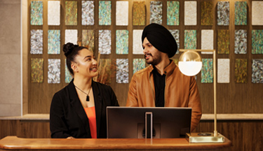 Hospitality Management student with a client