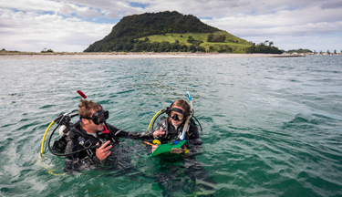 Marine students in the water with their dive gear