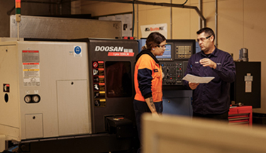 Engineering student talking with tutor