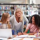 Tutor talking to their students