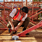 Carpentry student drilling in a screw