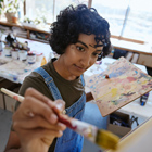Art student painting on a canvas