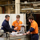 Engineering students with tutor