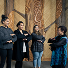 Students performing waiata with tutor