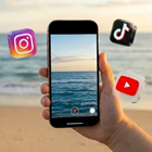 Student using smartphone at the beach