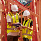 Construction Management students looking over building plans