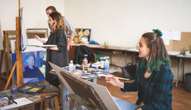 Creative students in class working on their art