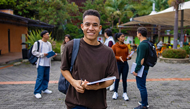 International student standing with his friends