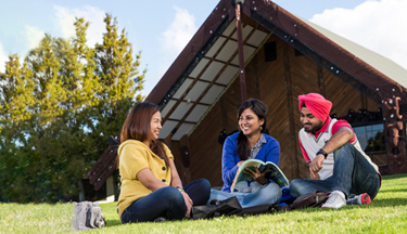 International students talking outside Tangatarua Marae