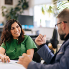 Postgraduate student talking with their tutor
