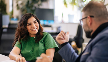 Postgraduate student talking with their tutor