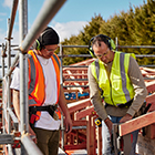 Carpentry student with tutor on a new build