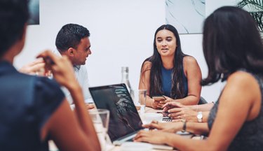 Students talking around the table