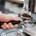 Barista student making a coffee