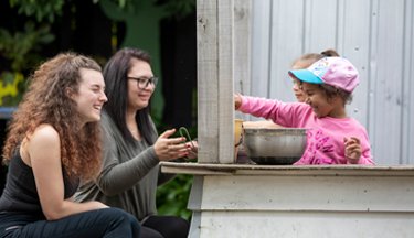 Student teachers playing with kids