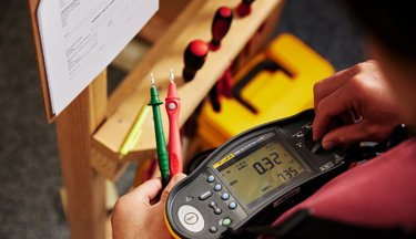 Electrical student testing voltage levels
