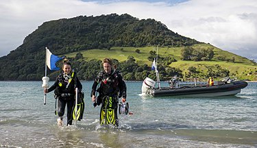 Marine students walking out from the water