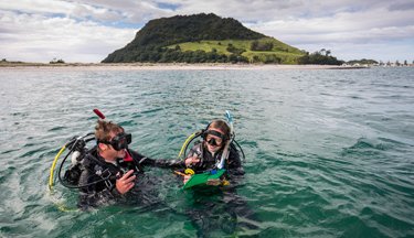 Marine students in the water with their dive gear