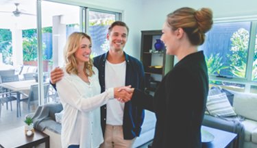 Real Estate agent with clients