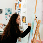 Creative student painting on a canvas