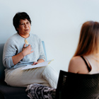 Social Work student talking with patient
