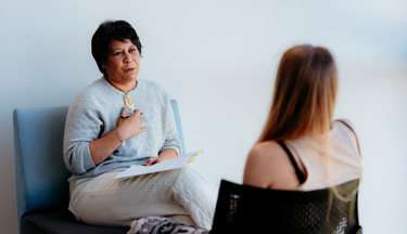 Social Work student talking with patient