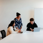 Business students with their tutor