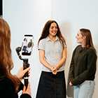 Student filming and interview on a smartphone