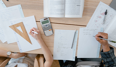 Students working through maths equations