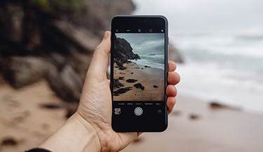 Student taking a photo on their phone
