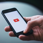 Student using their phone on YouTube