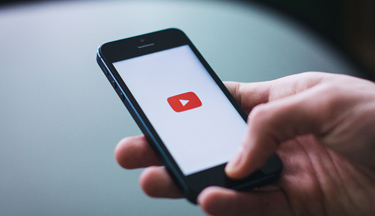 Student using their phone on YouTube